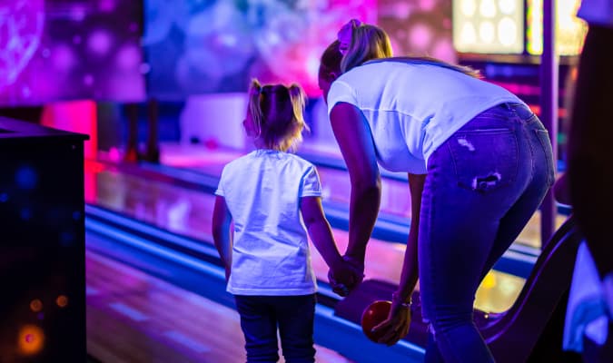 Glowzone Bowling holding hands