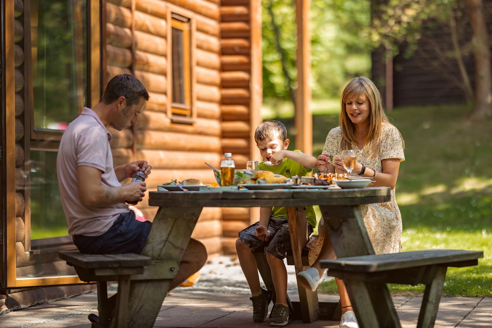 Family Eating Outside Their Lodge