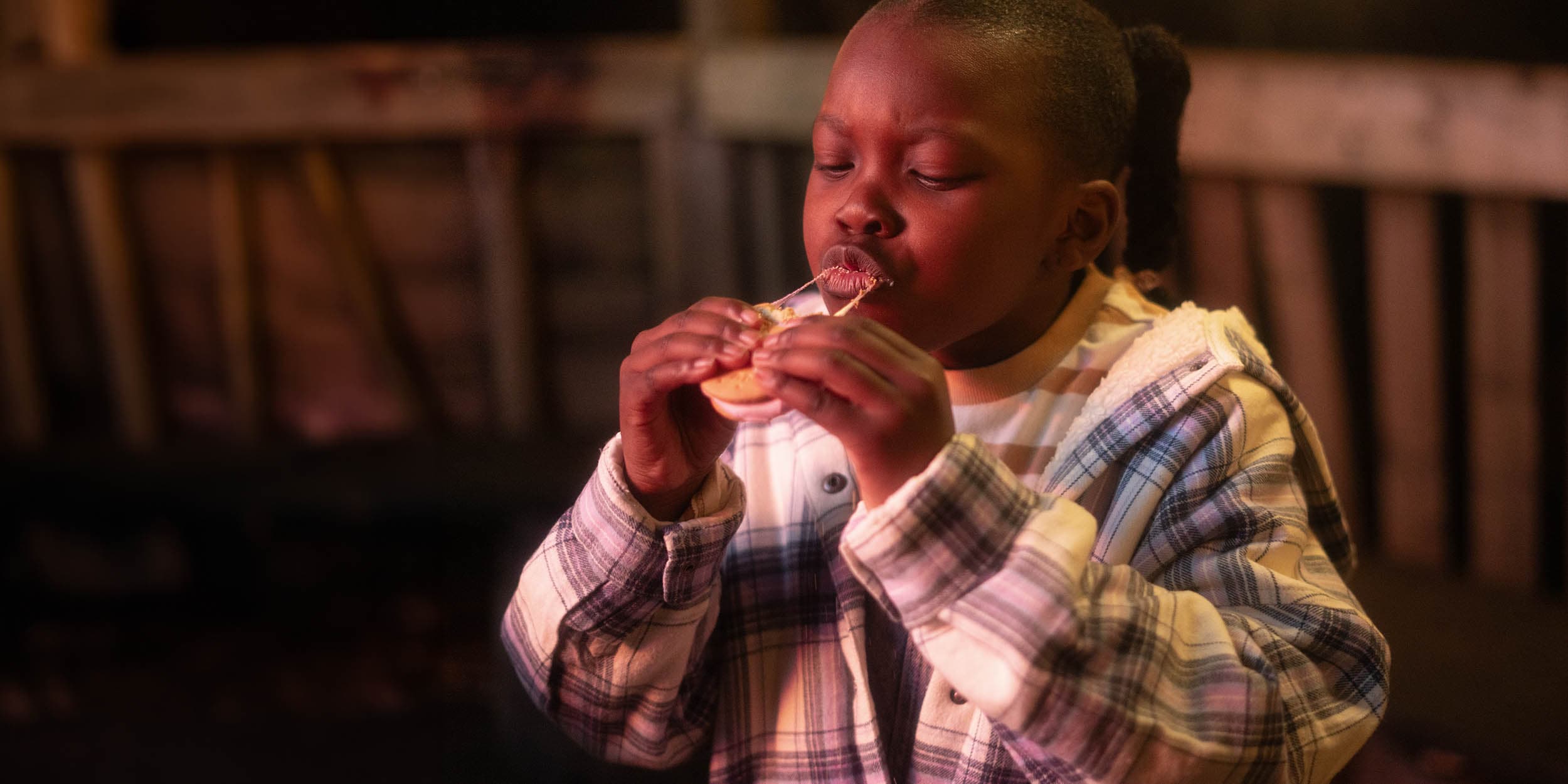 Child eating a Smore at Camp Smokey