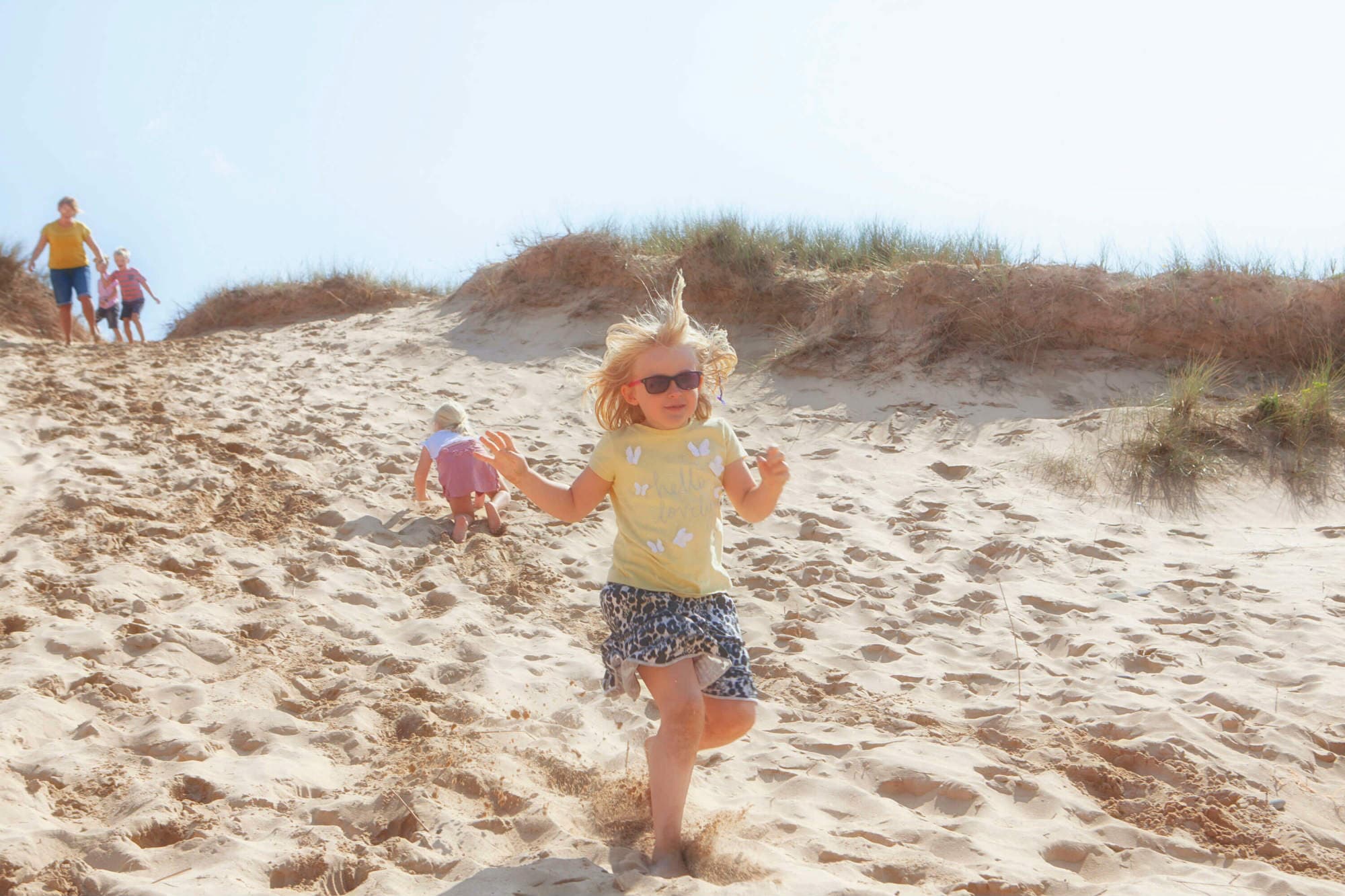 Girl Running Down Sand dune