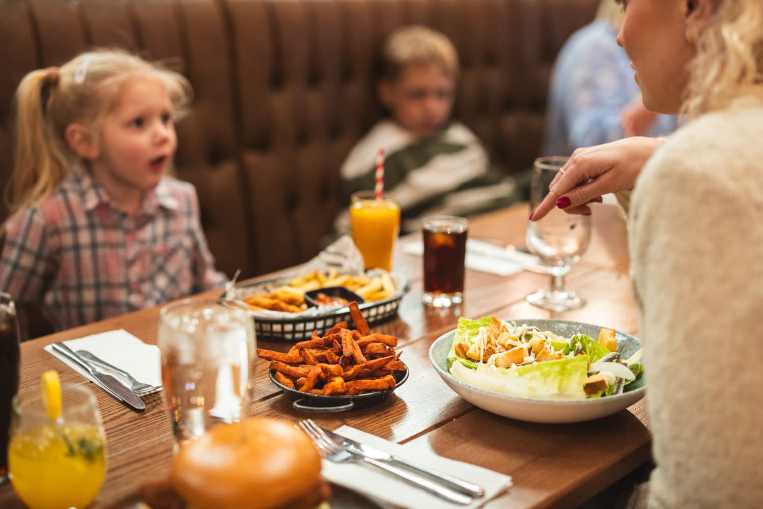 Girl family dining Farmhouse Grill Bluestone