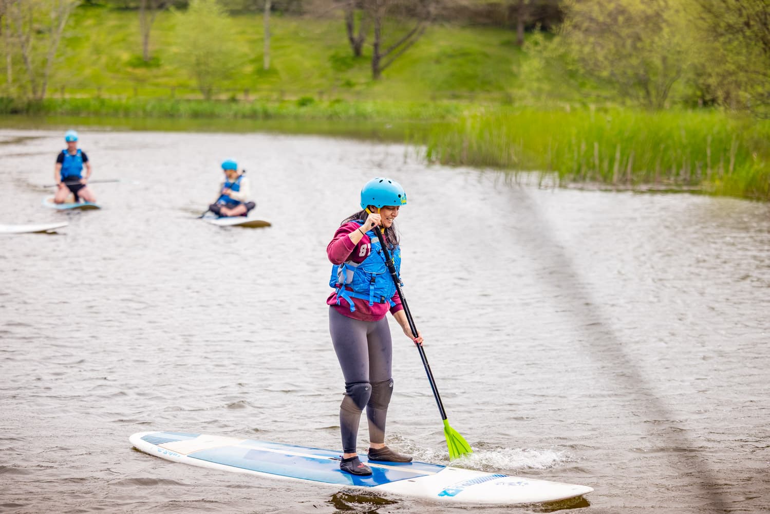 Paddle Boarding Teen Family Standing On Board