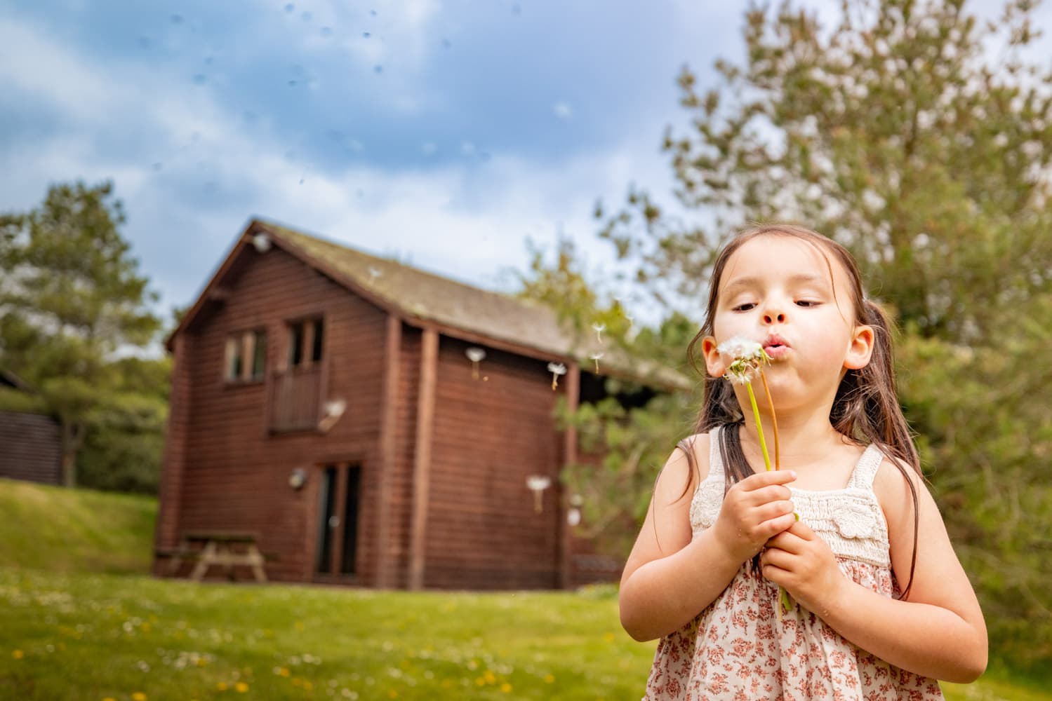 Girl with Flower outside lodge Bluestone