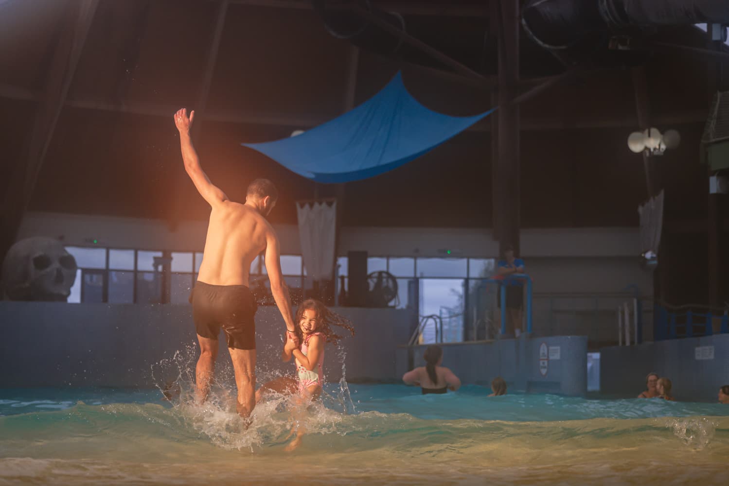 Dad & Daughter Playing In Blue Lagoon